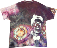 a tie dye t - shirt with an image of a man in a bow tie